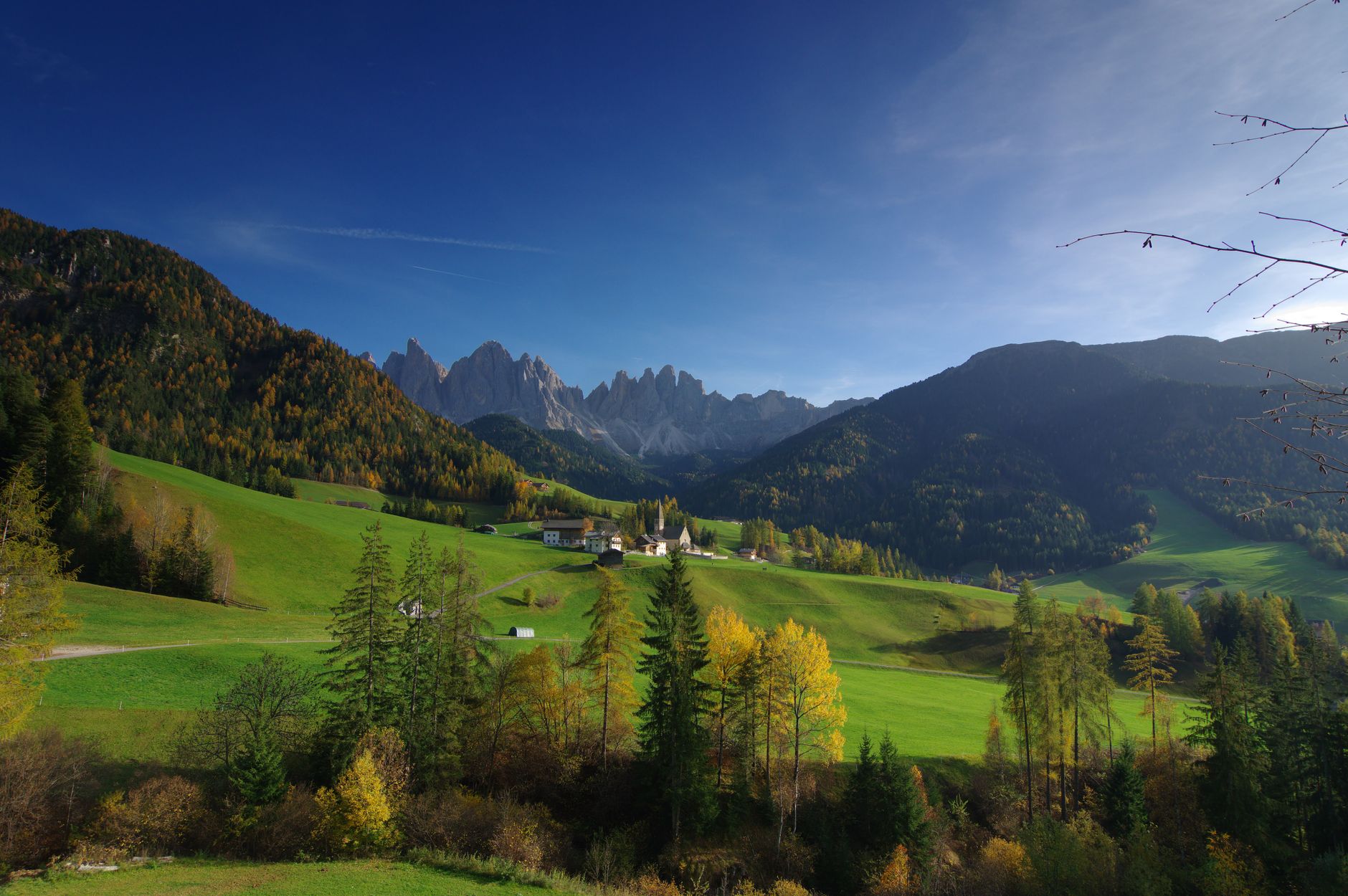 Panoramic view of the jagged peaks of the Dolomites at sunrise